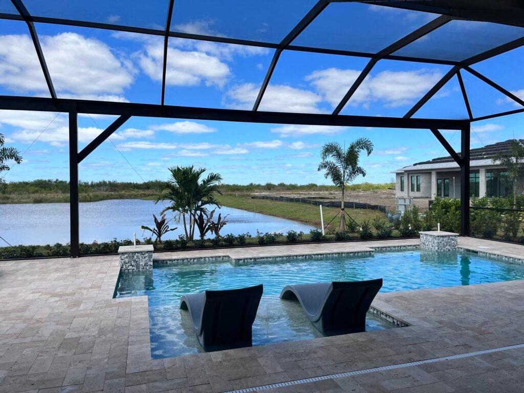 Commercial pool enclosure installation in Cocoa, FL at upscale waterfront property