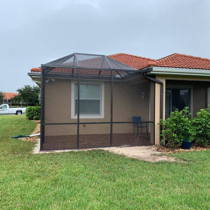 Screened patio extension installation in Cocoa, FL on single-story residential home
